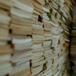 Stacks of used books ready to sell for cash at buyback sites